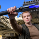 Cameron Monaghan wields the Cal Kestis lightsaber at Galaxy's Edge in Disneyland.